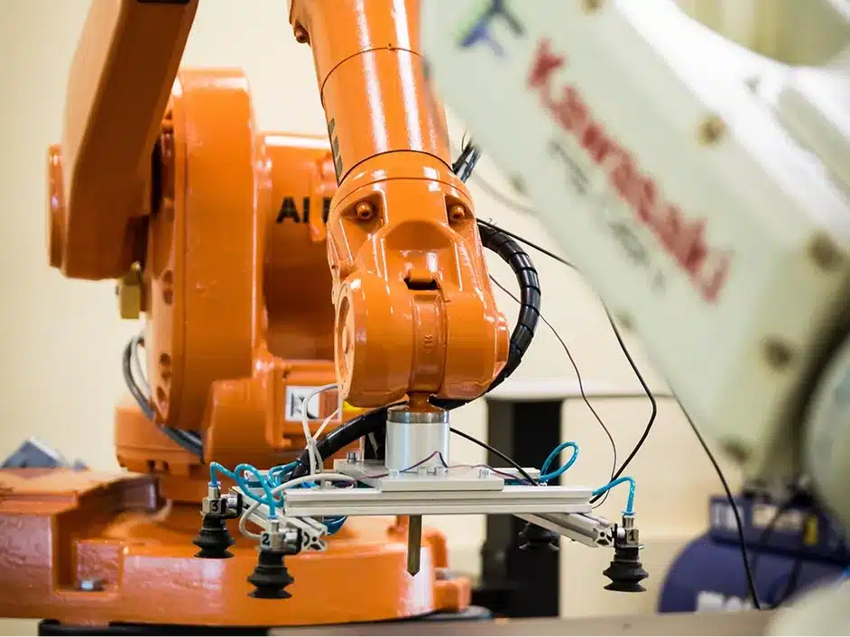 Robotic arm in an industrial machine setting