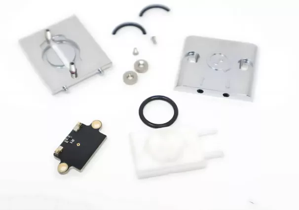 Assorted electronic components on white background.