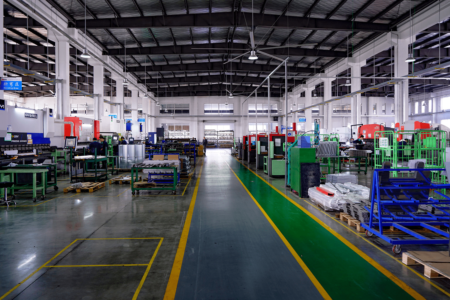 Large industrial factory interior with machinery.